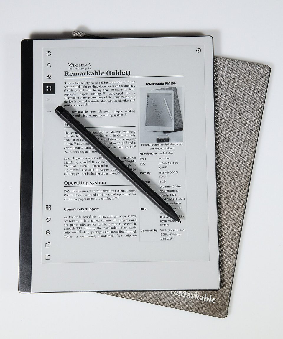 a reMarkable 2 e ink tablet with its marker and fabric folio, displaying a wikipedia article