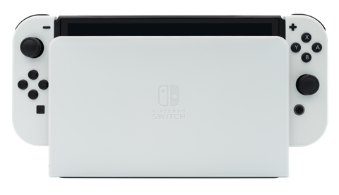 a white nintendo switch oled model docked in its white dock