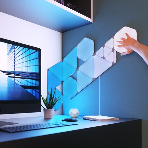 nanoleaf shapes hexagon light panels glowing on a wall