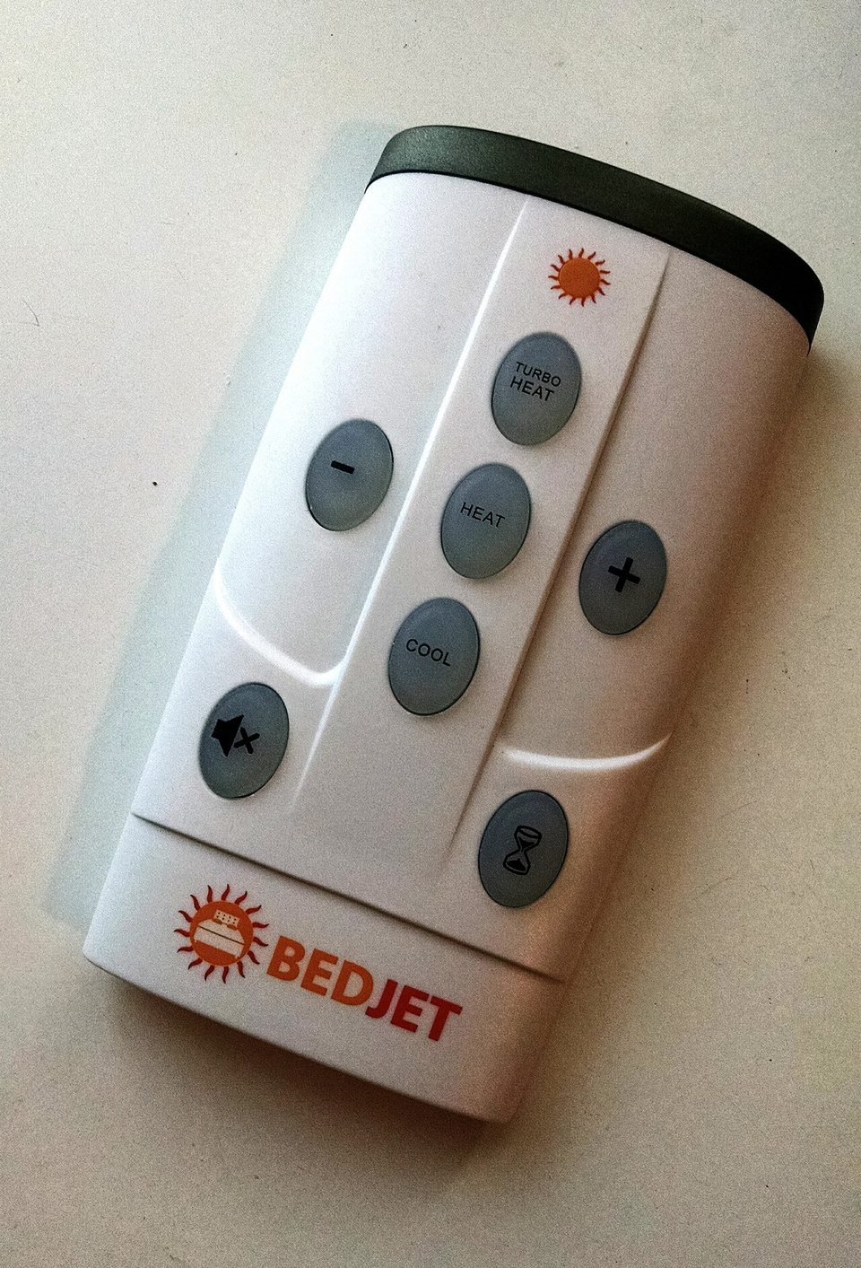 A BedJet remote control with a small LCD screen photographed up close