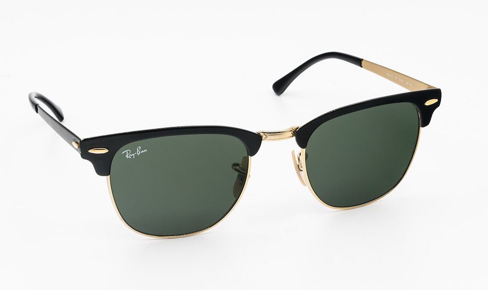 A pair of Ray-Ban Wayfarer sunglasses photographed up close