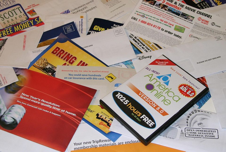 A pile of unopened junk mail collected at a home