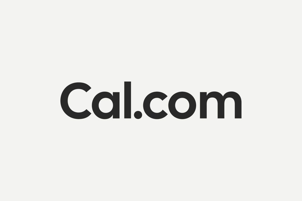 The Cal.com wordmark in charcoal letters centered on a pale gray background