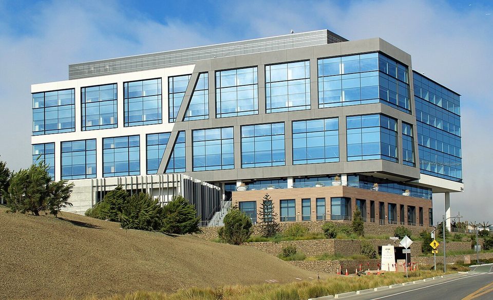 Stripe's headquarters, a glass office building on a grassy hillside in South San Francisco