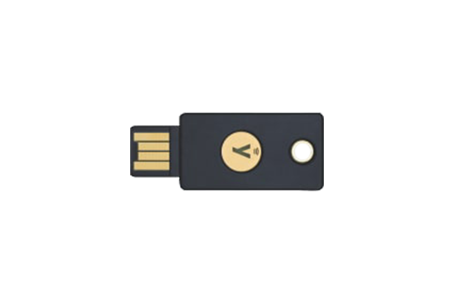 A flat grey USB security key with a gold contact and the YubiKey 5 NFC label on a dark background