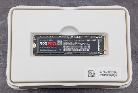 A Samsung 990 Pro M.2 SSD with the label facing up