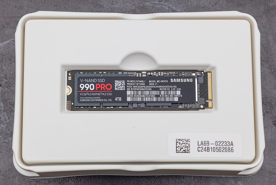 A Samsung 990 Pro M.2 SSD with the label facing up