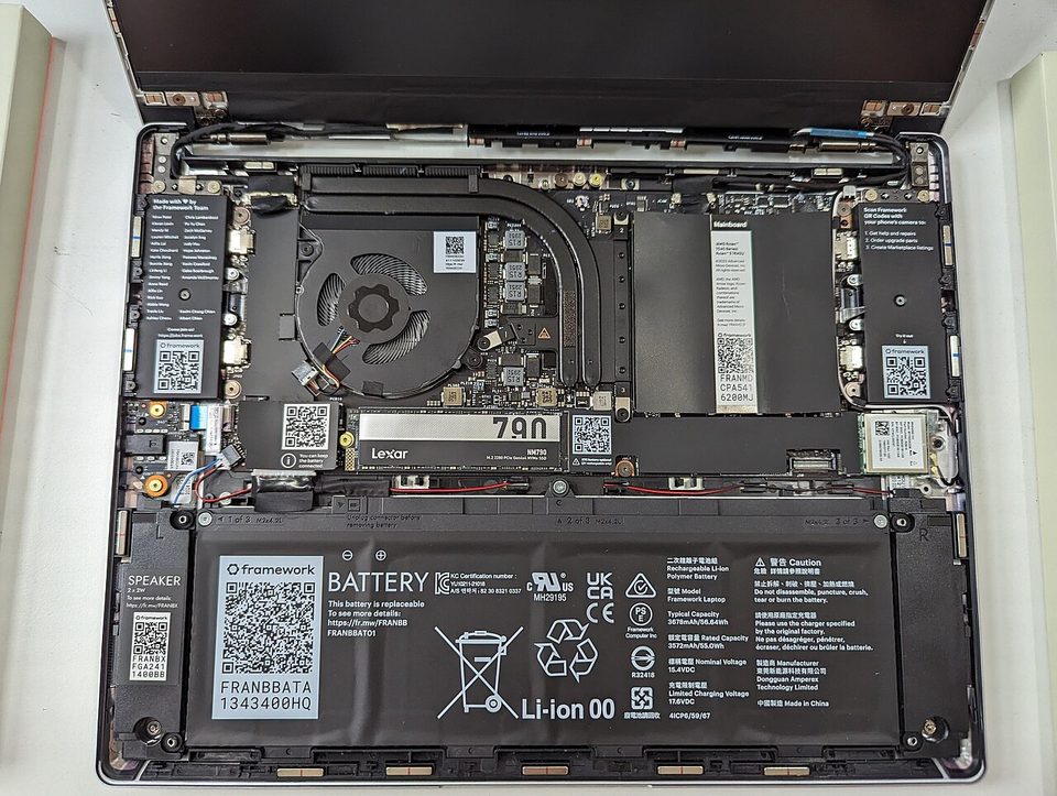 The internal motherboard and components of a Framework Laptop 13 with the bottom panel removed