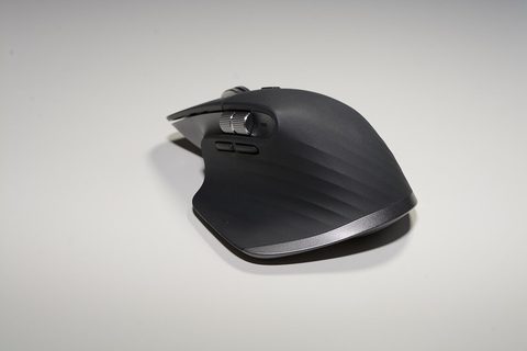 Close-up of a Logitech MX Master 3S mouse showing the scroll wheel and thumb rest