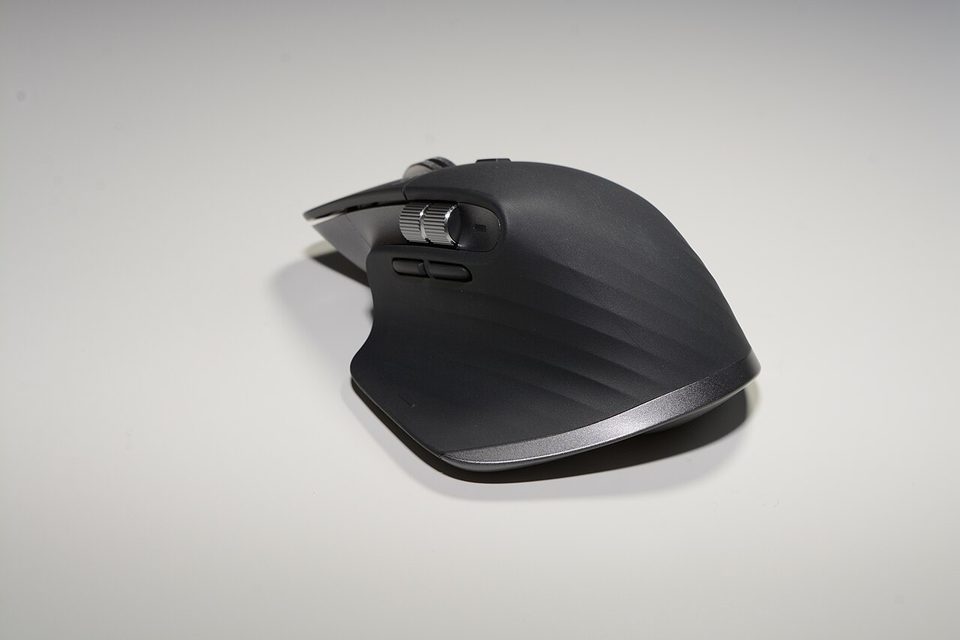 Close-up of a Logitech MX Master 3S mouse showing the scroll wheel and thumb rest