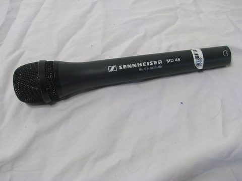 A handheld cardioid dynamic microphone, the same stick form factor as the ATR2100x-USB; a Sennheiser MD 46 shown