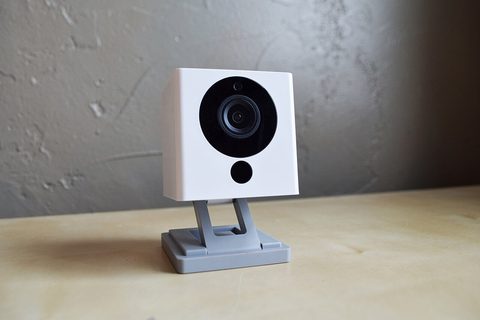 A Wyze compact security camera, the cube-on-legs design the v4 carries on