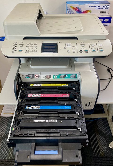 A compact HP LaserJet printer on a table