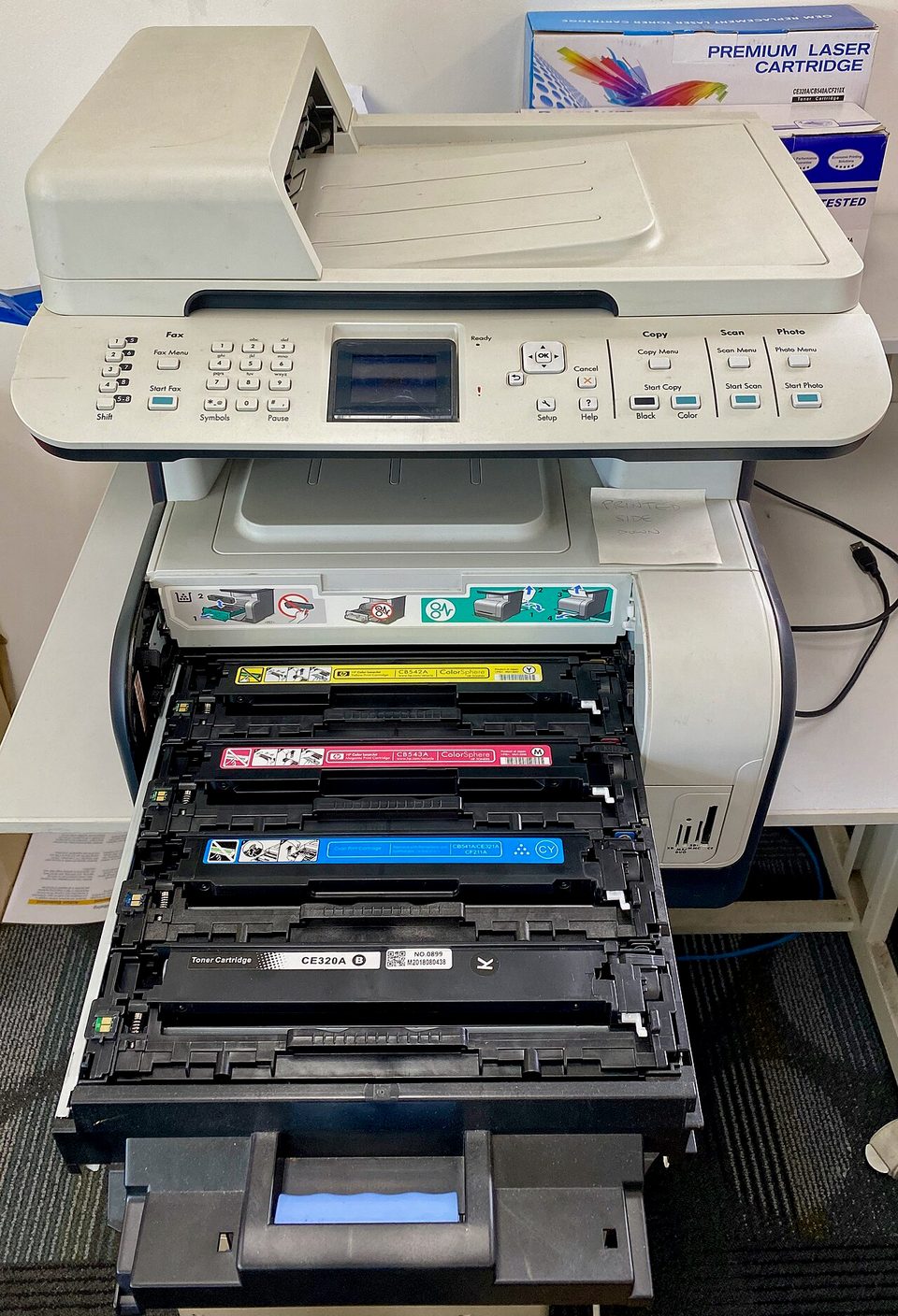 A compact HP LaserJet printer on a table