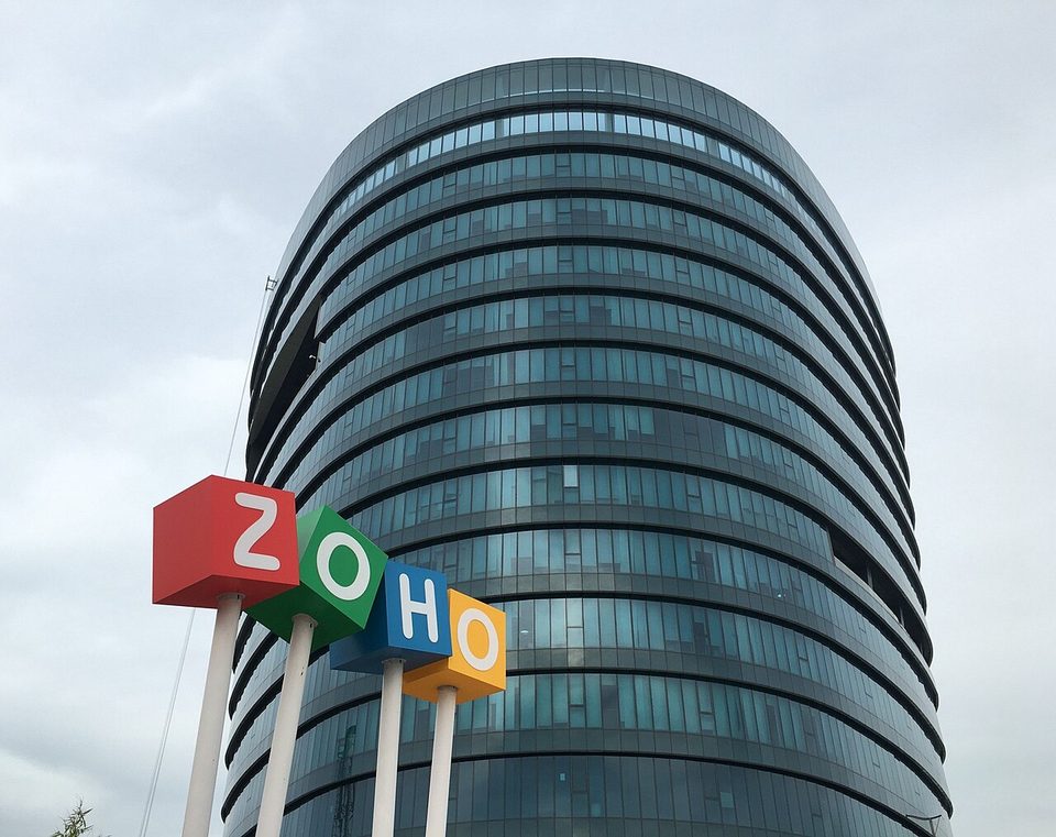 The round glass tower at Zoho's headquarters in Chennai, with the Zoho cube sign out front